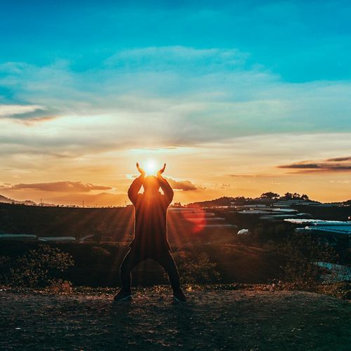 Sun rising over a calm landscape symbolizing a new beginning.